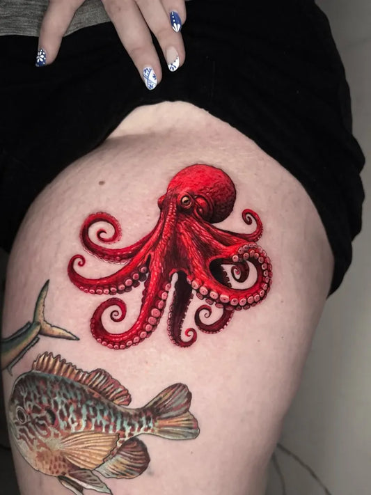 Big Realism Red Octopus and Fish Tattoo on Women Thigh by @stefaniaortelli