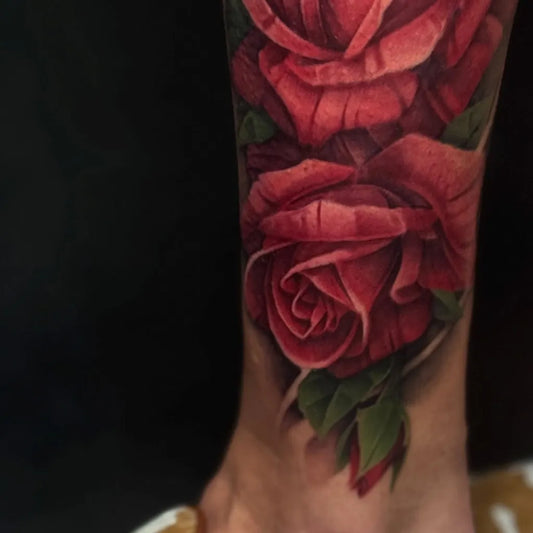 Big Realism Red Roses on Women Thigh Tattoo by @jameshallcreative