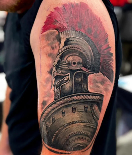 Big Realism Roman Helmet Tattoo on Men Bicep by @forever_blasting_ink