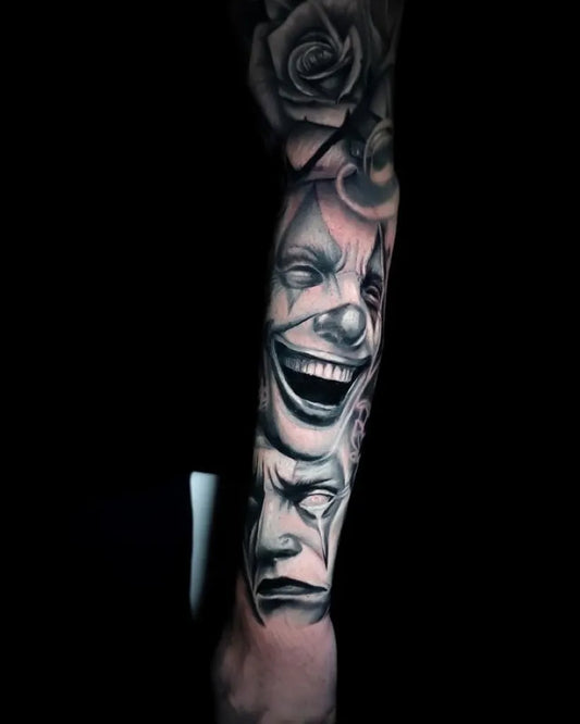 Big Realism Rose and Clown Mask Tattoo on Men Arm by @hammersmith_tattoo_london