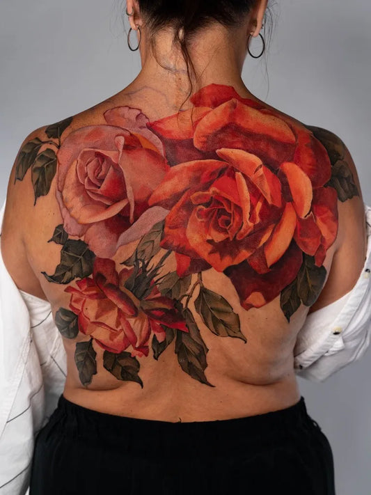 Big Realism Roses on Women Back Tattoo by @cass.fuller