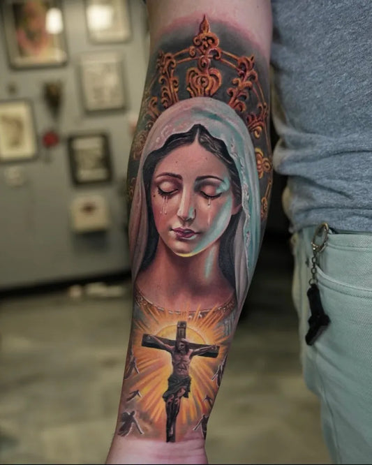 Big Realism Virgin Mary and Crucifixion Tattoo on Men Arm by @americantattoosociety