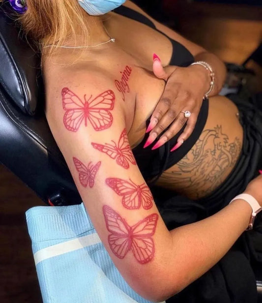 Red Butterflies on Women Arm Tattoo by @caretings
