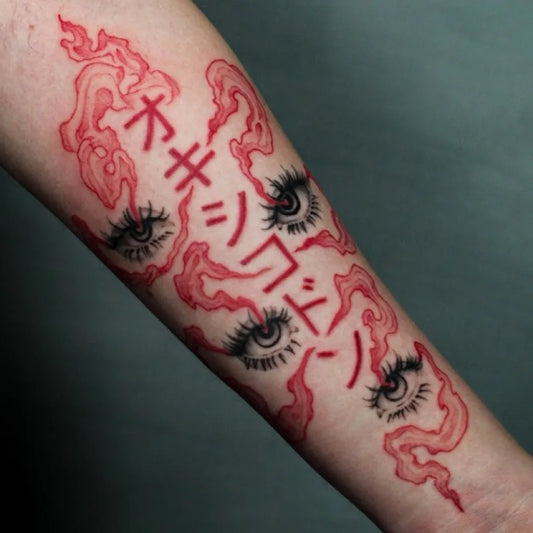 Big Red Japanese Text Eyes Tattoo on Women Arm by @_roma.noir