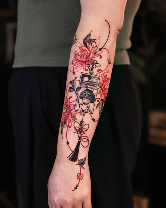 Big Red JapaneseBellWithFlowersAndRibbons Tattoo on Women Arm by @zeeyeart