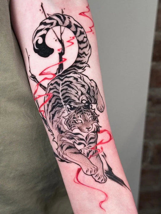 Big Red Tiger with Red Ribbon Tattoo on Men Arm by @miwhale.ink