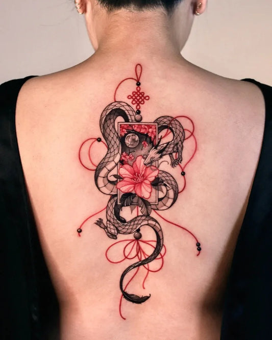 Big Red Twin Snakes and Lotus Tattoo on Women Back by @zeeyeart