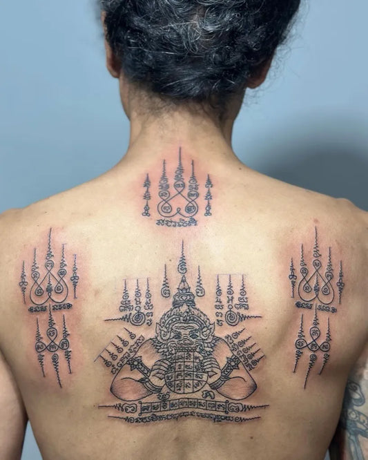 Big Sak Yant Hanak Sak Yant with Phra Ratcha Tattoos on Men Back by @preservation_khmer_sakyant
