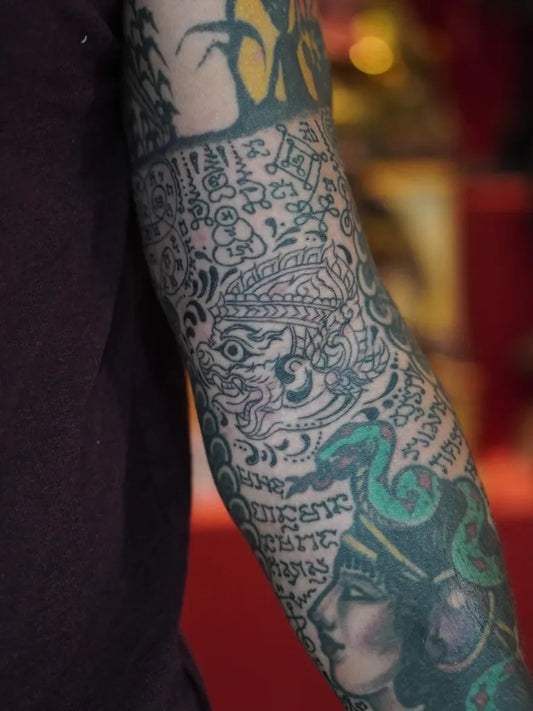 Big Sak Yant Hanakuan Snakes Tattoo on Men Arm by @sakyant_arjarn_fluke