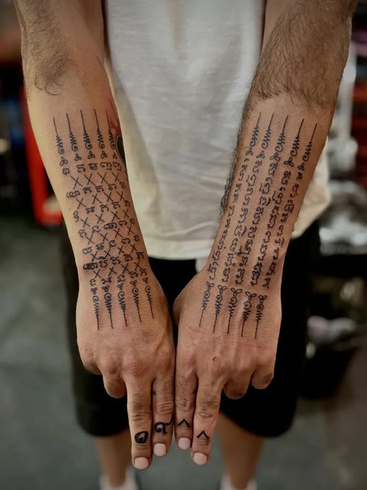 Big Sak Yant Sak Yant Script Tattoo on Men Forearms by @mr.tattoo_phuket