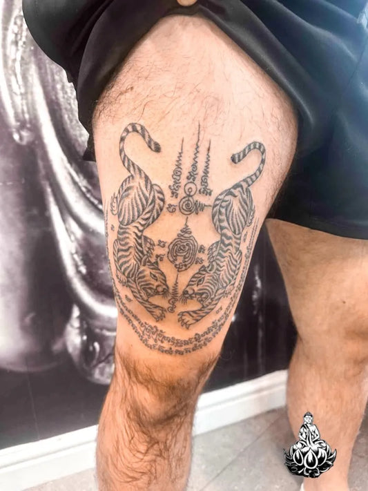 Big Sak Yant Tigers and Spires Tattoo on Men Thigh by @bambootattoomaster