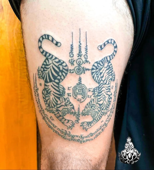 Big Sak Yant Twin Tigers with Yantra Tattoo on Men Thigh by @thebambooroomssamui