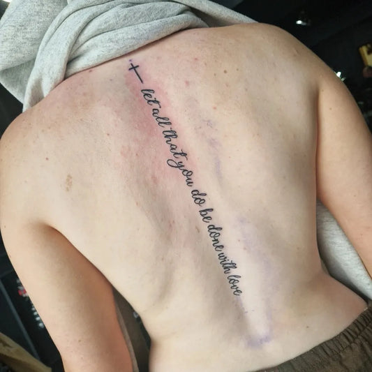 Big Scriptural Cross Quote on Women Spine Tattoo by @hailey_rebeyro