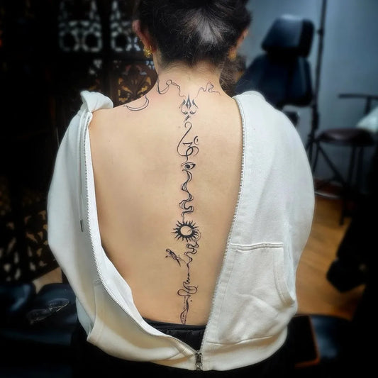 Big Scripture Sun Dragon on Women Spine Tattoo by @funkymonkeytattoos