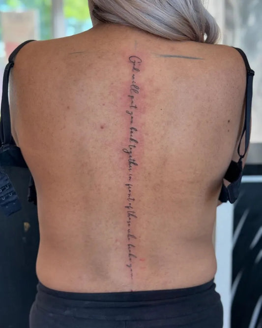 Big Scripture Words on Women Spine Tattoo by @blastin_1nk