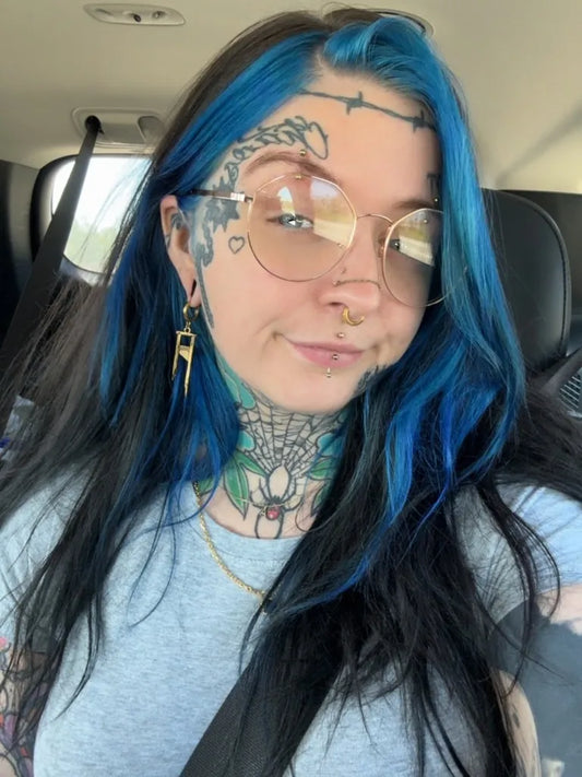 Big Spiderweb Barbedwire on Women Face Tattoo by @kalanntattoos