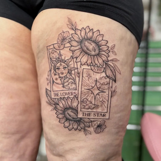 Big Tarot Cards and Sunflowers on Women Thigh Tattoo by @maiseytattoo