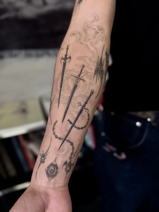 Big Three Swords and Rosary on Men Arm Tattoo by @alienboij