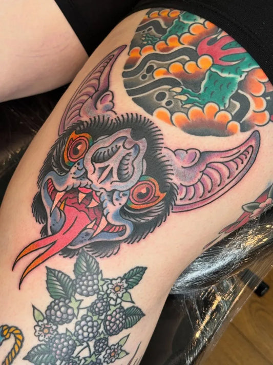 Big Traditional Bat Flowers Tattoo on Women Thigh by @philcollison