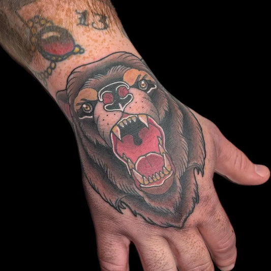 Big Traditional Bear Head on Men Hand Tattoo by @morguettetattoo