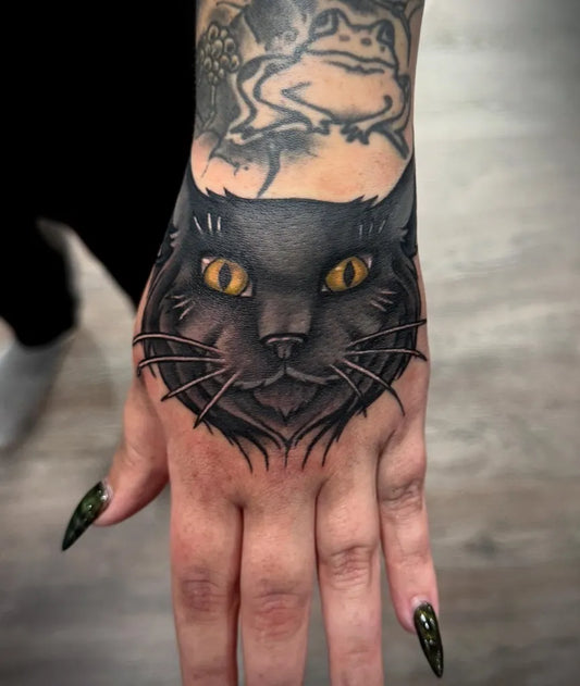 Big Traditional Black Cat with Frog and Flowers on Women Hand Tattoo by @broken_bat_ink
