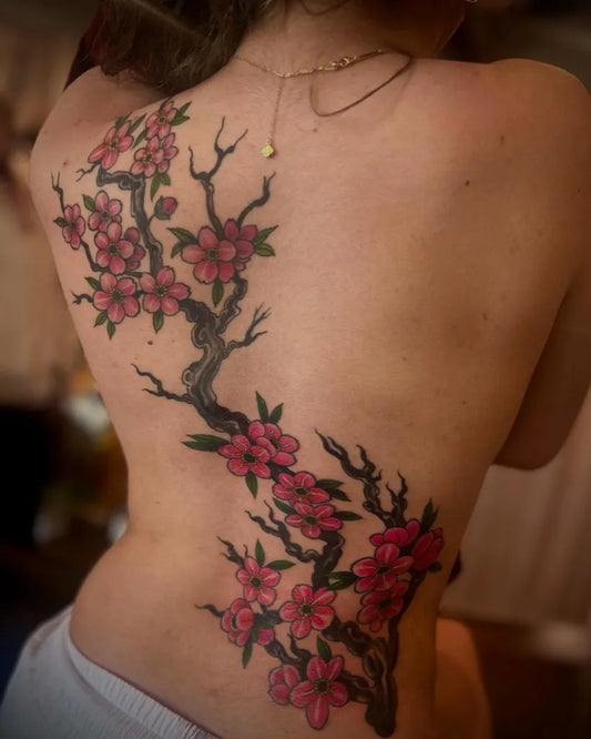 Big Traditional Cherry Blossom Branch on Women Back Tattoo by @tizbiztattoo