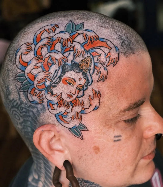 Big Traditional Chrysanthemum Face Tattoo on Women Head by @irezumiartist