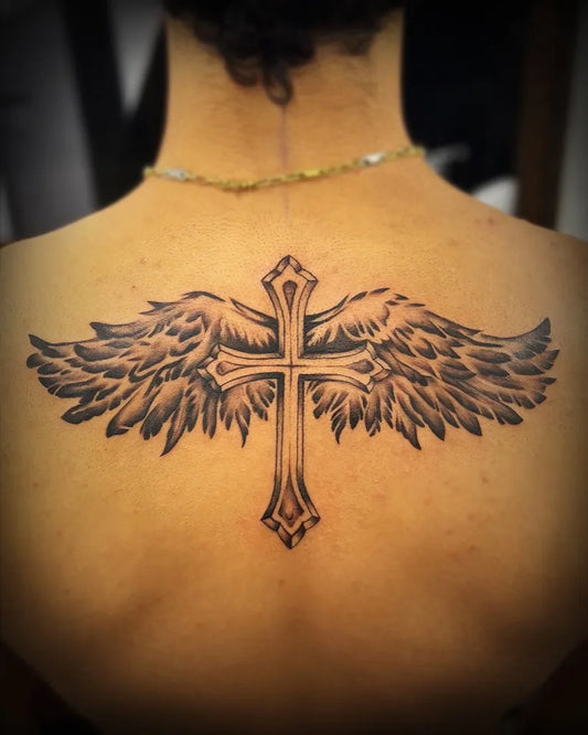 Big Traditional Cross with Wings on Women Back Tattoo by @charbelbecharatattoos