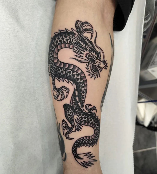 Big Traditional Dragon on Men Arm Tattoo by @knifepartytattoo