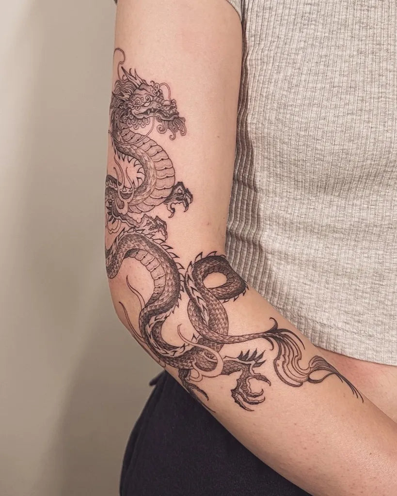 Big Traditional Dragon on Women Arm Tattoo by @ink.by.kiki