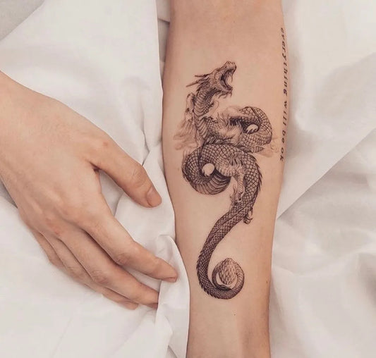 Big Traditional Dragon on Women Arm Tattoo by @theartoftattooingofficial