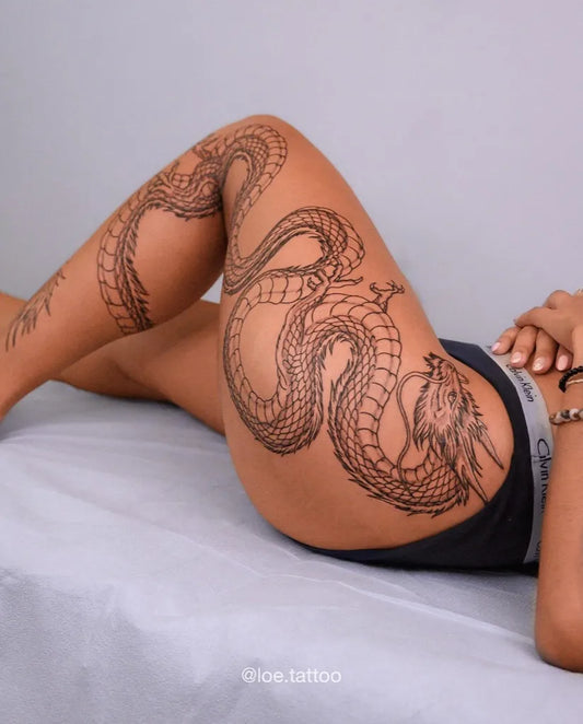 Big Traditional Dragon on Women Leg Tattoo by @loe.tattoo