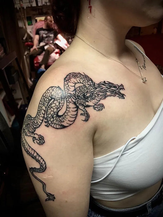 Big Traditional Dragon on Women Shoulder Tattoo by @gobo_tattoo