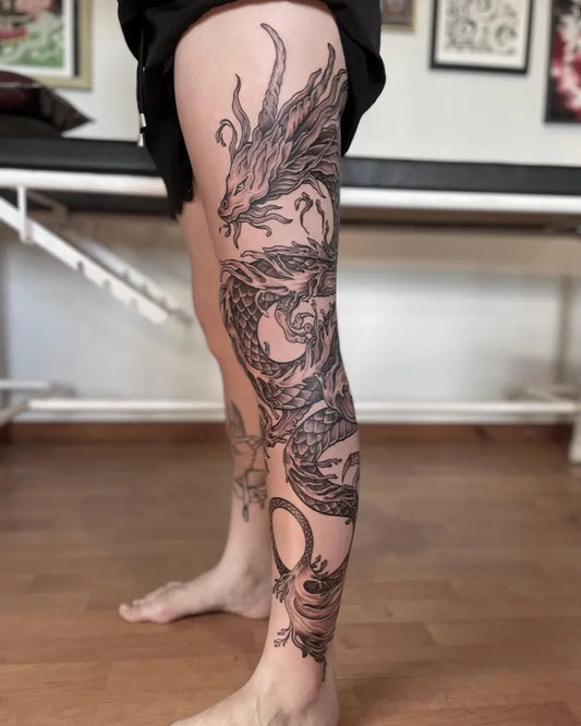 Big Traditional Dragon on Women Thigh Tattoo by @truealchemytattooing