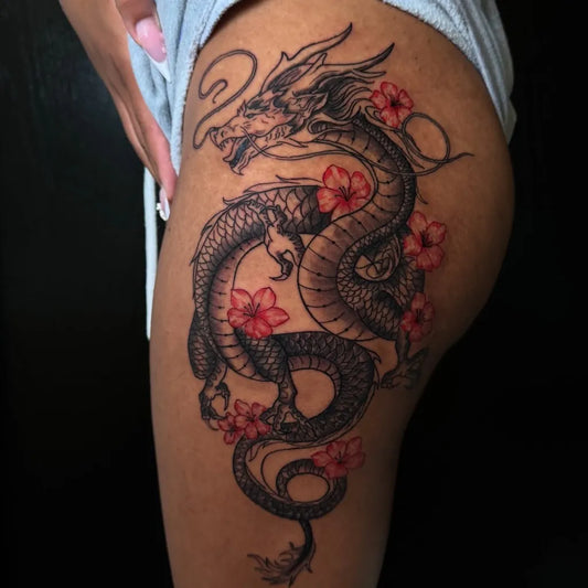 Big Traditional Dragon with Cherry Blossoms on Women Thigh Tattoo by @tattsbysean_