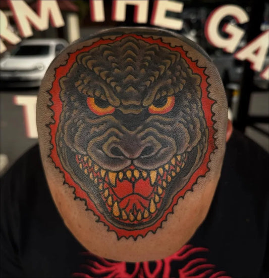 Big Traditional Godzilla Head Tattoo on Men Head by @dyl_tattoos