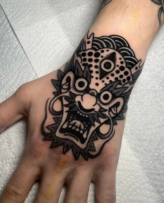 Big Traditional Hannya Mask on Men Hand Tattoo by @goodfortunestudio