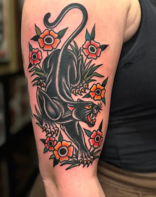 Big Traditional Panther and Flowers Tattoo on Women Arm by @idlehandsf