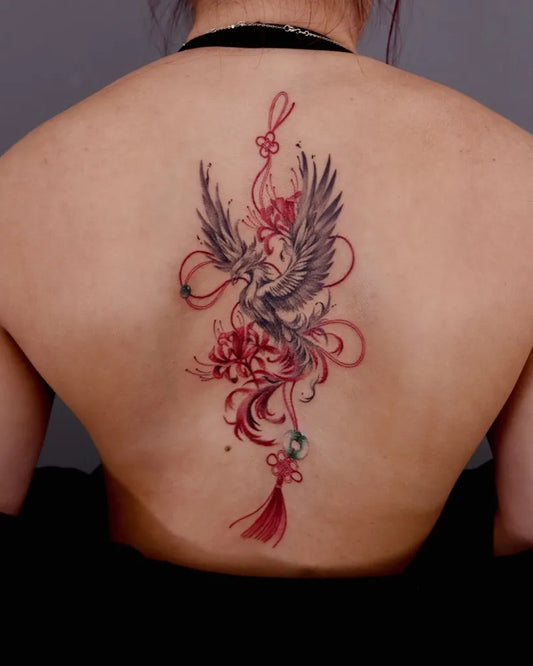 Big Traditional Phoenix with Flowers and Tassels on Women Back Tattoo by @minaa.ink