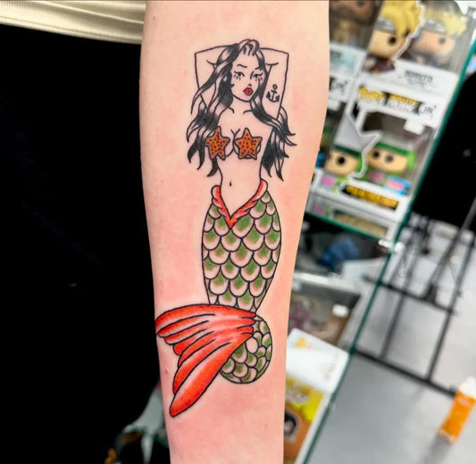 Big Traditional Pin Up Girl Mermaid Tattoo on Women Arm by @kikipainmaker