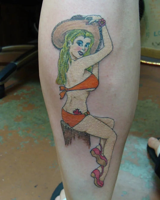Big Traditional Pin Up Girl with Cowboy Hat Tattoo on Women Leg by @head2toetattoo