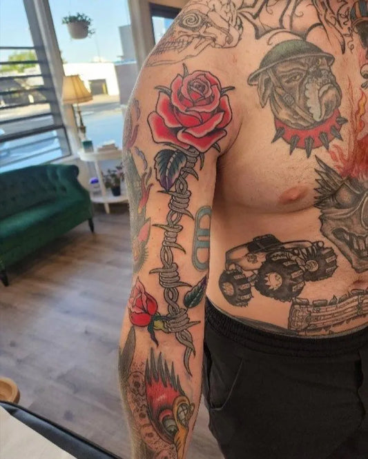 Big Traditional Rose Barbed Wire on Men Arm Tattoo by @rosecuttertacoma