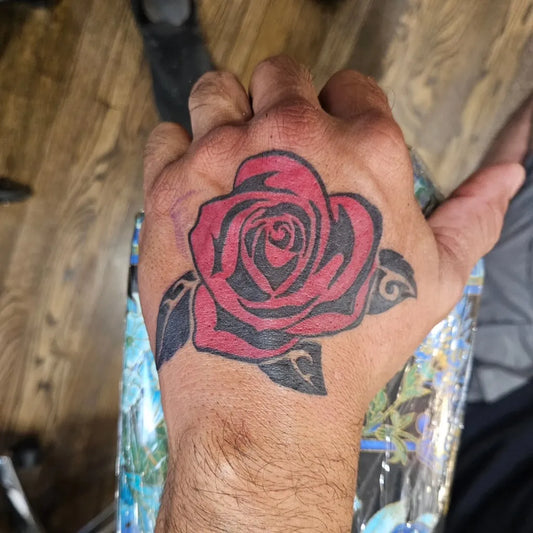 Big Traditional Rose on Men Hand Tattoo by @artbyalexarvizu