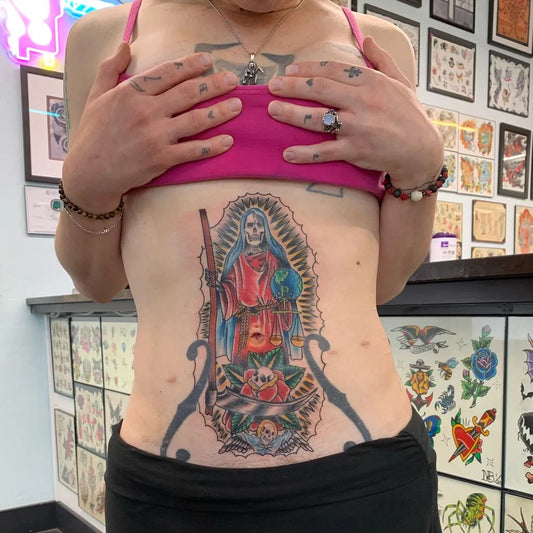 Big Traditional Santa Muerte with Roses and Skull Tattoo on Women Stomach by @nicholasbergin