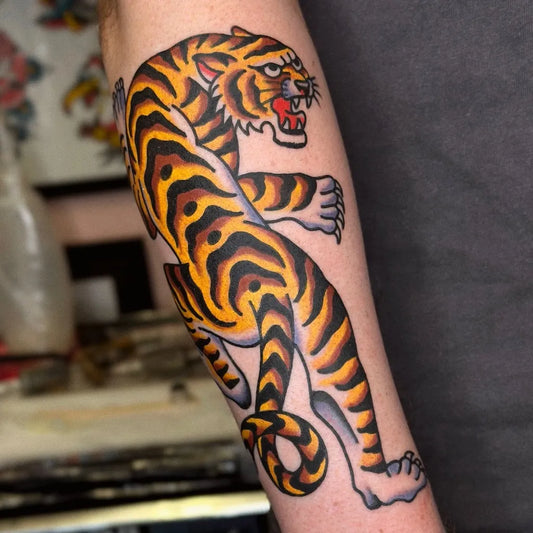 Big Traditional Tiger on Men Arm Tattoo by @mooneytattoos
