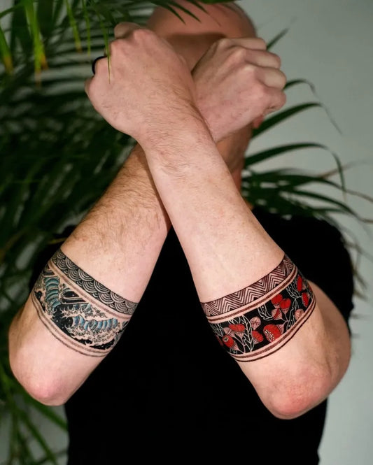 Big Tribal Band with Floral Motifs on Men Arms Tattoo by @tattoosfolder