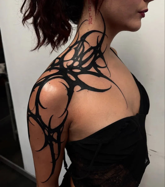 Big Tribal Biomechanical Thorns on Women Shoulder Tattoo by @delcortek