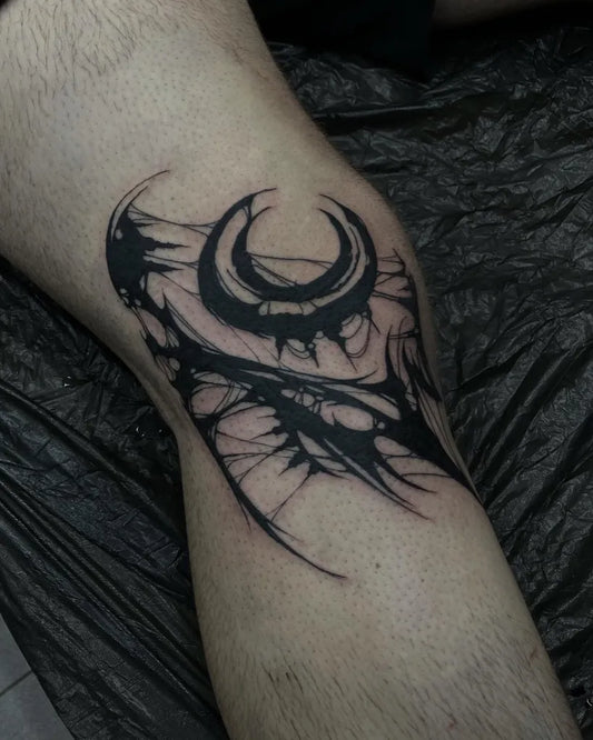Big Tribal Double Crescent with Spikes on Men Knee Tattoo by @nimmersatt.tattoos