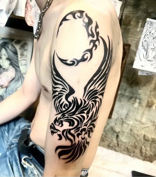 Big Tribal Flaming Moon and Eagle on Men Arm Tattoo by @ajito.osaka.tattoo