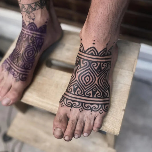 Big Tribal Geometric Bands and Floral Motifs on Men Feet Tattoo by @hannahtattooer